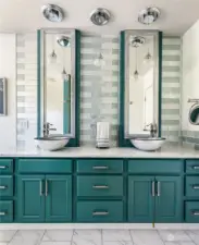 The little details of this bathroom like custom sinks, pendant lighting, and gorgeous cabinetry are incredible. Abundant drawers and storage keep the space practical - without impacting the light airy feeling.