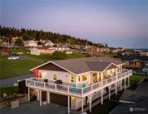 Facing West, this gorgeous home and its expansive deck take in shipping lanes of the Puget Sound and Mountain views from almost every window in the home. A 3-car garage offers generous space for vehicles, workshop, and storage!
