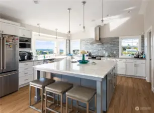 Get ready to be wowed by the custom island in this breathtaking kitchen. There's plenty of counter space to set out food for your guests or lay out the ingredients for cooking! Also room for more cooks in the kitchen,