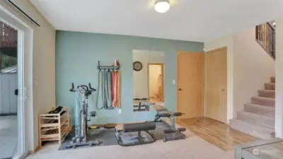 Convenient space for a workout area if desired or expand your family room seating capacity. Adjacent doors lead you to the oversized 2-car garage and additional storage space under the staircase.
