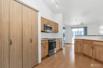 Spacious and open kitchen with pull out drawer under the cabinets and including the pantry