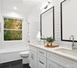 The other full bathroom upstairs also has  heated floors, tiled walls and double sinks  with quartz countertops.