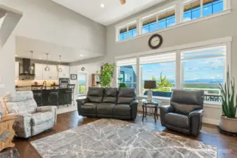 This classy, central main level living room is just that. LOTS OF ROOM to LIVE while enjoying vaulted ceilings, dancing light as the sun coasts from East to West.