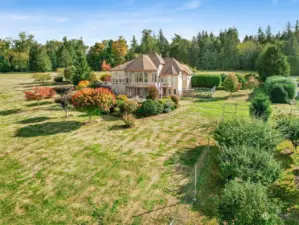 2+ acres of professionally landscaped land including a private orchard