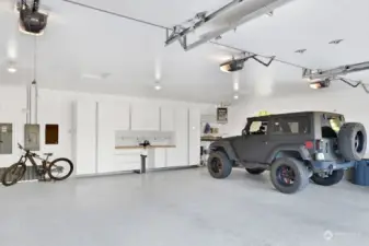 Extra large 3-car garage with storage and workspace