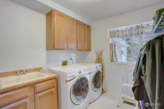 First Floor Utility Room with Front Loading Washer and Dryer, Utility Sink and Windows!