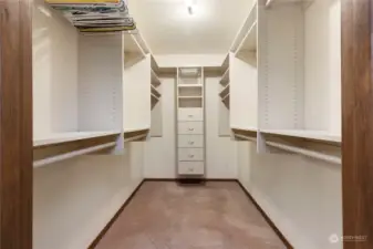 Primary bedroom walk-in closet with built-ins.