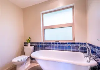 Upstairs bath with tub and shower handle. Recently renovated.