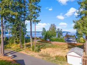 You don't find much buildable land in town, but here is a rare lot that has views across to Gig Harbor East side to Vashon and beyond that you don't have to tear a house down to build on.