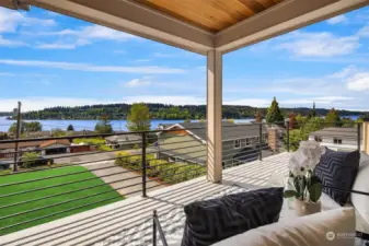 Deck off of primary bedroom with expansive views of Lake Washington