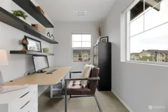 Tech room makes fantastic work from home office with two windows letting in lots of natural light