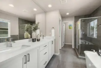 Primary bathroom with double vanity, quartz counter tops