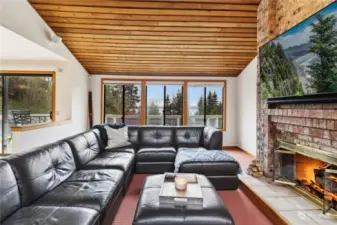 Relax in the spacious living room, complete with fireplace and soaring ceilings.