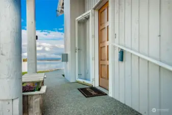 Home has a side entry with a view of the water as you arrive home.