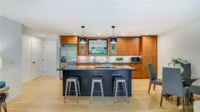Open concept floor plan, custom kitchen cabinets, granite countertops and hardwood floors.