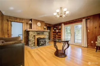 French doors off living room to spacious deck overlooking peaceful, treed setting.