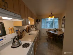 Spacious kitchen with quartz counter tops, eat-in dining area and pantry closet. All Appliances stay. 8414 John Dower Rd SW #3, Lakewood, WA 98499