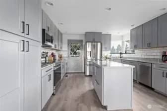 Recently remodeled kitchen with new plank flooring