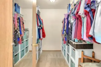 Primary bedroom walk-in closet