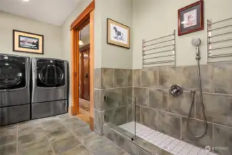 Laundry/mud room on the main floor boasts a deluxe dog bath area, with hot and cold water spray!