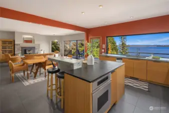 The center island is topped with soapstone and features an appliance garage and Dacor oven