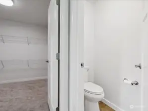 Huge primary walk-in closet and water closet