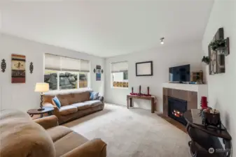 Living area off kitchen with gas fireplace for chilly nights