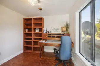 Office with built in cabinetry on opposite wall as well