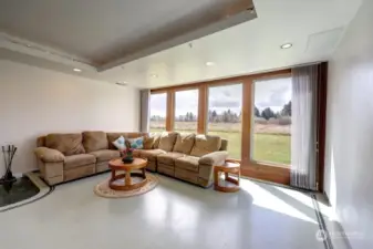 Living room with lot's of sunlight with the southerner exposure. This home has floor heat through out