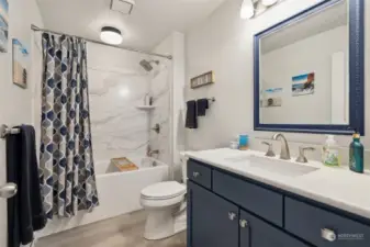 Designer Bathroom with Soaking Tub and Upscaled Bathroom Vanity and Fixtures.