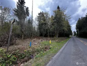 166' frontage to Jefferson Beach Rd x 616' deep, 2.5 acres.. Jefferson Beach Rd is on school bus route. Bonus: it's snow plowed by county in Winter. Kitsap County Police rated, "Safest" neighborhood. 5-10 minutes from ferry.