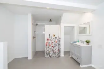 Spacious primary bathroom with easy access shower