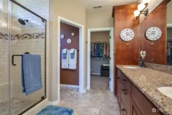 Private primary bath has dual sinks, large walk-in closet