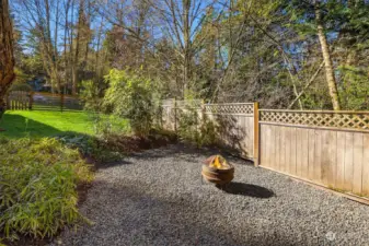 The property has lawns, gardens and this special spot with fire pit.