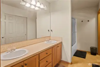 Primary Bathroom - The main level primary bathroom offers serenity with its private 5-piece ensuite bath with a large walk-in closet, soaking tub, and a separate enclosed bidet.