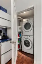 Washer/Dryer Unit in its own closet by the kitchen.