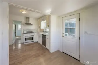Laundry room off of kitchen, with door to 2nd patio and yard!