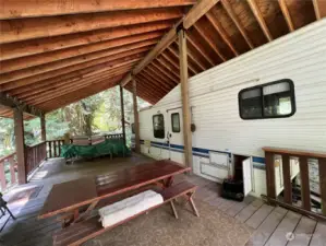 Large covered porch with picnic table that stays