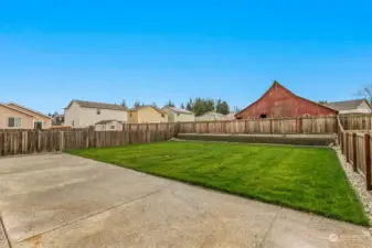 This is a brand new yard, terraced, rockery perimeter, grassy play area, entertainment sized patio for group BBQ's and fun at home. PLUS you get the barn, gotta love the barn!