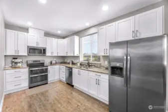 Granite countertops, stainless steel appliances, lots of cabinet storage.