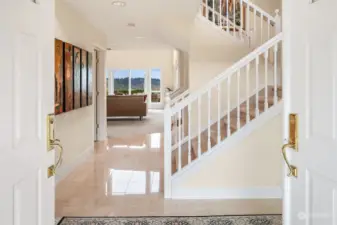 From the moment you enter, the quality of this home is apparent. Shimmering marble floors provide a hint of what is to come. The unique staircase ascends on two sides and ushers you to the second floor.