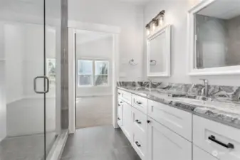Primary's bathroom with walk-in tile shower, beautiful accents and light and bright.