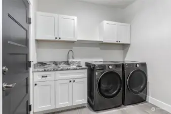 Delightful utility room with ample storage space