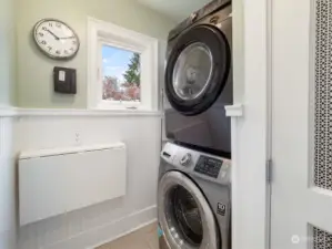 Full laundry room with folding table