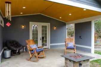 Covered patio off of the living room, notice the Tongue & Grove ceiling.