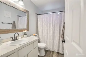 Full bath with tub/shower combo on the upper level.