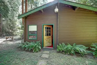 Sturdy Pan Abode 546 sq. ft. cabin has underground power, water, 2 bedroom septic and an RV dump close by.