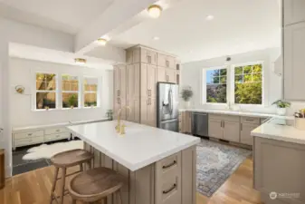 Fabulous kitchen features all new floor-to-ceiling cabinets, island with seating, two sinks, garbage disposal, Insta hot faucet...