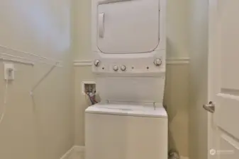 Spacious laundry room located in the hallway adjacent to the garage. 2018 GE Washer & Dryer