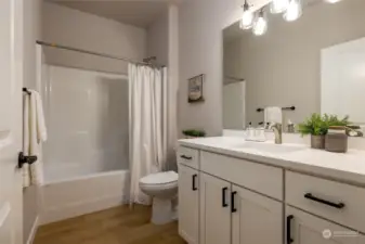 The actual house does not have white cabinets and other colors or features may differ.  Photos are to help in marketing only.